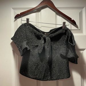 Adorable off the shoulder black with polka-dots and a bow on the front top
